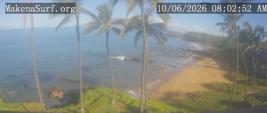 Beach cam view from Makena Surf over Po'olenalena Beach on the morning of October 6, 2026: a wide band of golden sand curving south along the shore